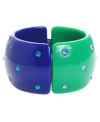 Color blocking is a trend you'll want to get in on. Haskell's chic style combines a bright blue and green design with sparkling blue crystals. Crafted in acrylic with an enamel overlay and a mixed metal hinge closure. Approximate diameter: 2-1/2 inches.