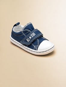 Cute, comfy classics with grip-tape closure in a denim design that'll add a little coolness to any ensemble.Grip-tape closureCanvas upperCanvas liningRubber soleTraditional Chuck insoleImported