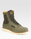 Lace-up leather high top design highlights two-toned paneling in suede and cotton canvas with a comfortable, contrasting Vibram sole.Suede/cotton upperLeather liningPadded insoleVibram soleImported