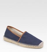 Summertime serenity with a natural look in herringbone cotton canvas, trimmed in leather and finished with sturdy jute detail along the sole. Slip-on style Jute/rubber sole Imported 