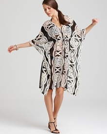 Dramatic, elegant and subtly sheer, Echo's printed caftan is your go-to coverup for glamorous getaways.