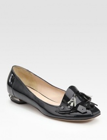 Sharp and sophisticated patent leather design, accented with a silver-edged heel, gunmetal studs and matching tassels.Self-covered heel, ¼ (5mm) Leather lining and sole Made in ItalyOUR FIT MODEL RECOMMENDS ordering one size up as this style runs small. 