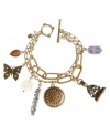 Bohemian beauty. Wrap your wrists in Lucky Brand's charming double-row bracelet. A butterfly, feather, filigree charm and medallion combine with multicolored plastic stones for a breezy-chic look. Set in mixed metal with a toggle clasp. Approximate length: 7-3/4 inches.