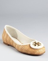 In summery raffia and crisp white leather, these warm-weather flats beg for a vacation. From Tory Burch.