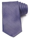 Incredible texture defines this luxurious silk tie from Michael Kors, the perfect pizzazz piece for special occasions or a fine addition to your professional wardrobe.