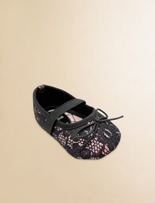 A pretty lace overlay with tiny bows and elastic straps across the instep.Polyurethane shoeRound toeElastic instep strapMicrofiber liningSoft polyurethane soleImportedAdditional InformationKid's Shoe Size Guide (European Equivalent) 