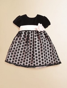 With a flower detail at the waist, gorgeous velvet and a polka-dot skirt, this pint-sized party dress is a must-have for the season.CrewneckBack button closureShort sleevesSash with flower detailTulle skirtPolyesterFully linedDry cleanMade in the USA of imported fabrics