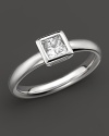 A sophisticated diamond ring with bezel-set, princess-cut stone.