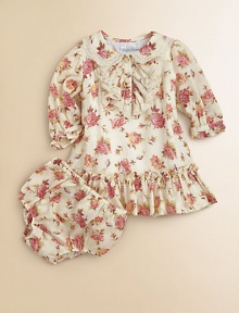 A sweet floral print adorns this girlie dress that comes with matching bloomers.Peter Pan collarLong sleeves with ruffled hemButton-frontDrop waistRuffled hemCottonMachine washImported Please note: Number of buttons may vary depending on size ordered. 