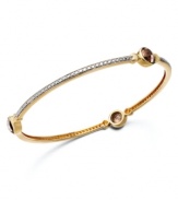 A slim row of sparkle makes a big impact. Victoria Townsend's pretty bangle bracelet slips over the wrist and shines in round-cut smokey quartz (3-9/10 ct. t.w.) with diamond accents. Set in 18k gold over sterling silver. Approximate length: 8 inches. Approximate diameter: 2-1/2 inches.