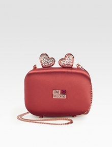 A sweet style in smooth satin embellished with logo plaques and stone accented hearts.Concealable chain shoulder strap, 21½ dropMagnetic top closureFully lined4½W X 3H X 1½DImported