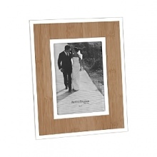 A faux bamboo insert provides the perfect backdrop, with silver accents for a natural yet eye-catching frame.