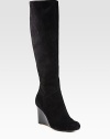 Knee-high silhouette of velvety suede has a towering wedge and convenient back zipper. Stacked wedge, 3 (75mm)Shaft, 16½Leg circumference, 14½Suede upperBack zipperLeather liningRubber solePadded insoleImported