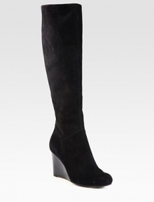 Knee-high silhouette of velvety suede has a towering wedge and convenient back zipper. Stacked wedge, 3 (75mm)Shaft, 16½Leg circumference, 14½Suede upperBack zipperLeather liningRubber solePadded insoleImported