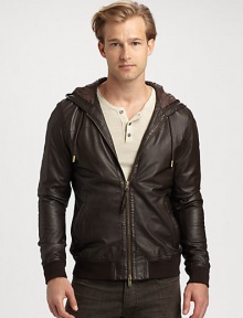 A rich leather jacket with a two-way zip front, is a definite wardrobe essential, while an attached hood lends a contemporary edge that is both rugged and refined.Two-way zip frontAttached drawstring hoodWaist slash pocketsBanded cuffs and hemAbout 26 from shoulder to hemLeatherDry cleanImported