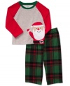 Put him in the holiday spirit with this adorable santa shirt and plaid pant pajamas set from Carter's.