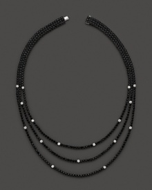 Faceted black sapphires, punctuated by diamonds, form three dazzling strands. By Roberto Coin.