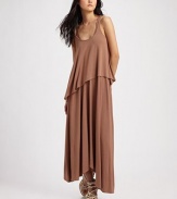 Draped jersey knit hangs in a chic, asymmetrical silhouette for modern styling.Scoopneck Wide straps Asymmetrical hem Scoopback 97% modal/3% spandex Hand wash Imported