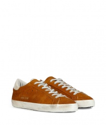 Luxe with a retro edge, these sneakers from Golden Goose will kick your style into high gear - Round toe, lace-up style, perforated side star detail, rubber sole - Pair with jeans or cargo pants, a tee, and a leather jacket