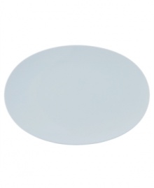 Simply smooth and modern in crisp white porcelain, the TAC 02 oval platter offers a timeless balance of form and function.