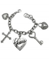 GUESS makes an elegant statement with this charm bracelet. Crafted from silver-tone mixed metal, the bracelet gets a sophisticated touch with glass crystals. Item comes packaged in a signature GUESS Gift Box. Approximate length: 7-1/2 inches. Approximate drop: 1-1/2 inches. Approximate diameter: 1-1/2 inches.