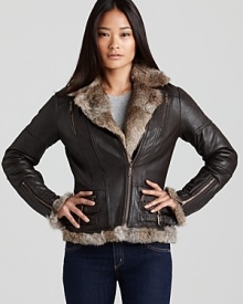 Plush shearling lends glamour to the sleek silhouette of this Kors Michael Kors leather jacket. The asymmetric zip adds modern edge.