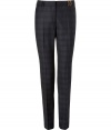 Stylish pants made of fine, dark grey plaid wool - Fashionable, slim and straight cut with pleats - Side pockets, welt pockets with buttons at back - Favorite everyday pants for the office with a blouse and blazer or cardigan, and with heels or flats