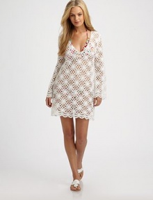 A crochet coverup that is beyond gorgeous.V-neckLong sleevesPull-on stylePolyesterDry cleanMade in USA of imported fabric