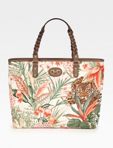 Safari-inspired in rich vary-print canvas, finished with leather trim and braided top handles.Double top handles, 6¼ dropTop zip closureProtective metal feetOne inside zip pocketTwo inside open pocketsCotton lining12½W X 10¼H X 3¾DPattern may varyMade in Italy