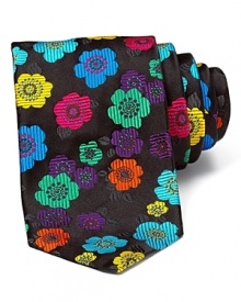 Make your professional look pop. Bold stylized flowers adorn this luxurious textured silk tie from duchamp.