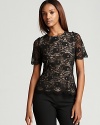 Black lace defines a fluttering peplum hem for a Bloomingdale's exclusive Gerard Darel top brimming with modern romance. Offset the sculptural silhouette with a slick pencil skirt for modern polish.