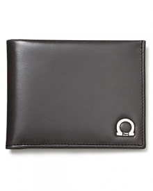 Constructed in smooth Italian leather, this handsome wallet demonstrates Salvatore Ferragamo's commitment to and mastery of craftsmanship and superior materials.