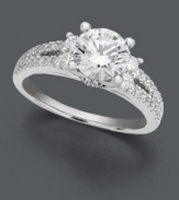 A traditional engagement ring with a special spin. A beautiful round-cut solitaire diamond (1-1/4 ct. t.w.) features two bordering rows of round-cut diamond (1/2 ct. t.w.) and an intricate side design with complementing diamond accents. Ring crafted in enduring 18k white gold. IGI Certified diamonds.