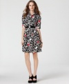 Pops of red accentuate the black and white heart print on Jessica Simpson's adorable belted shirtdress. (Clearance)