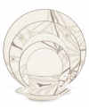 Place settings with abstract markings in soft shades of khaki fill in glazed white china dinnerware for unconventional elegance. From Noritake dinnerware, these dishes have matte platinum bands and the cup's arched, geometric handle that look sharp on casual and formal tables alike.