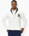 A handsome shawl collar and preppy embroidered crest lend authentic collegiate style to a supremely soft fleece cardigan.