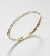 From the Brilliance Collection. Half of this graceful bangle is paved with sparkling rhinestones, the other half has a smooth, polished finish, with a handy hinge in between.GlassGoldtoneDiameter, about 2.5Hinged with push-lock claspImported