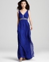 This beaded SW Studio by Sue Wong gown lends a rich look with embellished details and a royal blue hue.