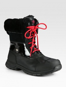 Plush shearling lines the folded-down cuff of a waterproof winter boot, constructed in durable leather with suede detail and rugged rubber trim.Leather upperLeather liningPadded insoleLug soleImported