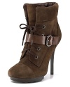 Soft suede, wrapped with a bold strap, gets an edge on autumn style with hiking boot details. By GUESS.