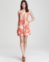 An exposed front zip toughens up this otherwise feminine Volcom dress, imbued with a bold, graphic print.