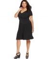 Look slender and sensational with Elementz' short sleeve plus size dress, featuring a flattering crisscross front and slimming panel-- wear it from day to play!