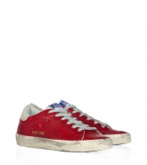 Modeled after vintage tennis shoes, this high-end version from Golden Goose will add an instant upgrade to your casual-cool style - Round suede toe, lace up front, leather upper with perforated side star detail, contrasting embossed leather logo detail, stylishly distressed rubber sole - Style with skinny jeans, a mini-skirt, or cut off denim shorts