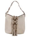 A little fringe goes a long way on this boho sling by Lucky Brand. Tonal suede macrame decorates this leather crossbody for a laid back urban-chic appeal.