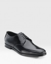 Highly polished Italian spazzolato leather lace-up oxford with an apron toe. Leather lining Padded insole Leather and rubber sole Made in Italy 