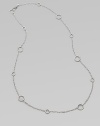 A long design punctuated with multiple sized circle links. Sterling silver Length, about 36 Lobster clasp closure Imported 