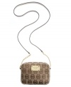 This travel-ready crossbody by MICHAEL Michael Kors is ready to jet set wherever you are. A signature exterior is accented with a high-shine logo plaque at front and chain embellished straps.