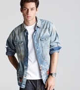 An elegantly wasted denim shirt with distressing, bleaching and plaid patches for that artist-in-residence look.