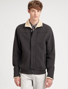 A casual wardrobe staple, this zip-up jacket breathes new life to an old favorite; crafted in a supremely soft cotton blend with a faux-sherpa lining at the collar and cuffs for the ultimate experience of style and comfort.Zip frontSnap-button placketSide slash pockets85% cotton/15% polyesterMachine washImported