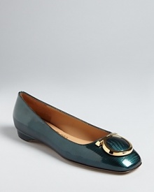 In high-polish leather with distinctive logo accents, these flats are fabulously Salvatore Ferragamo.